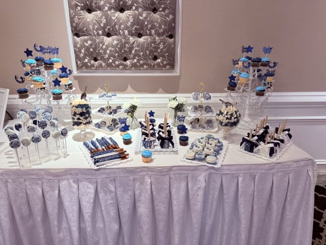Elegantly styled dessert table by Timeless Treats