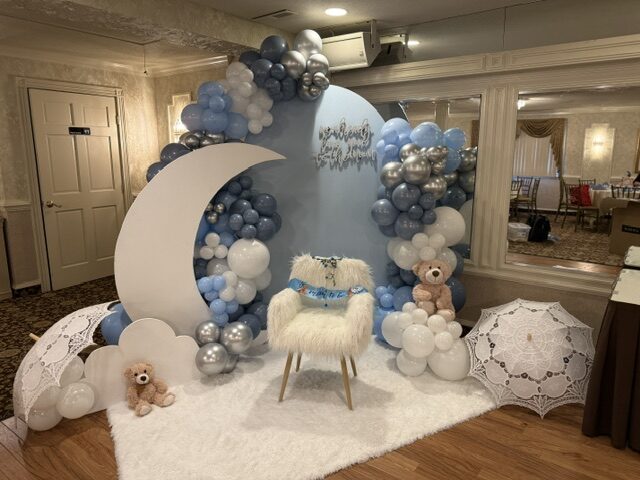 Blue and white balloon arch with moon centerpiece by Timeless Treats