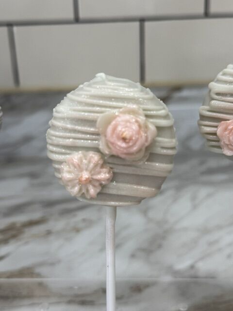 Elegant blush and gold cake pops by Timeless Treats